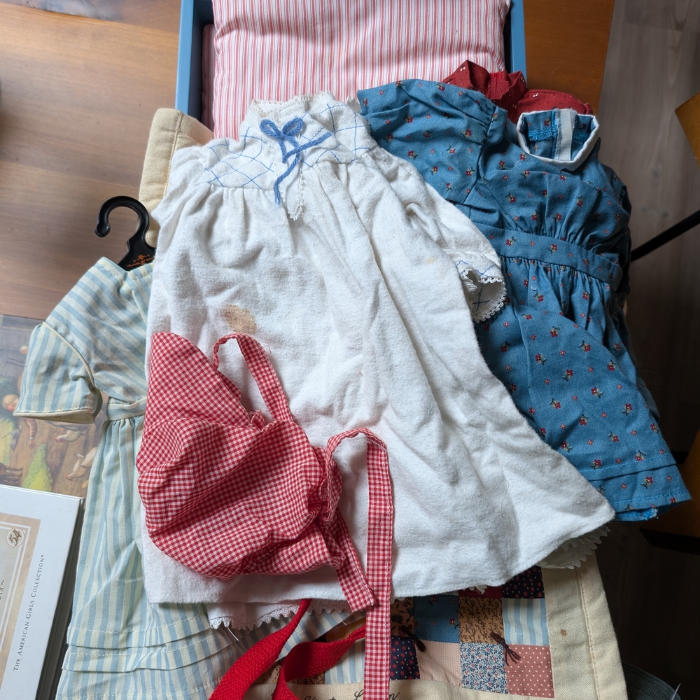 Vintage Kirsten Doll Dress Collection in White, Red, and Blue.